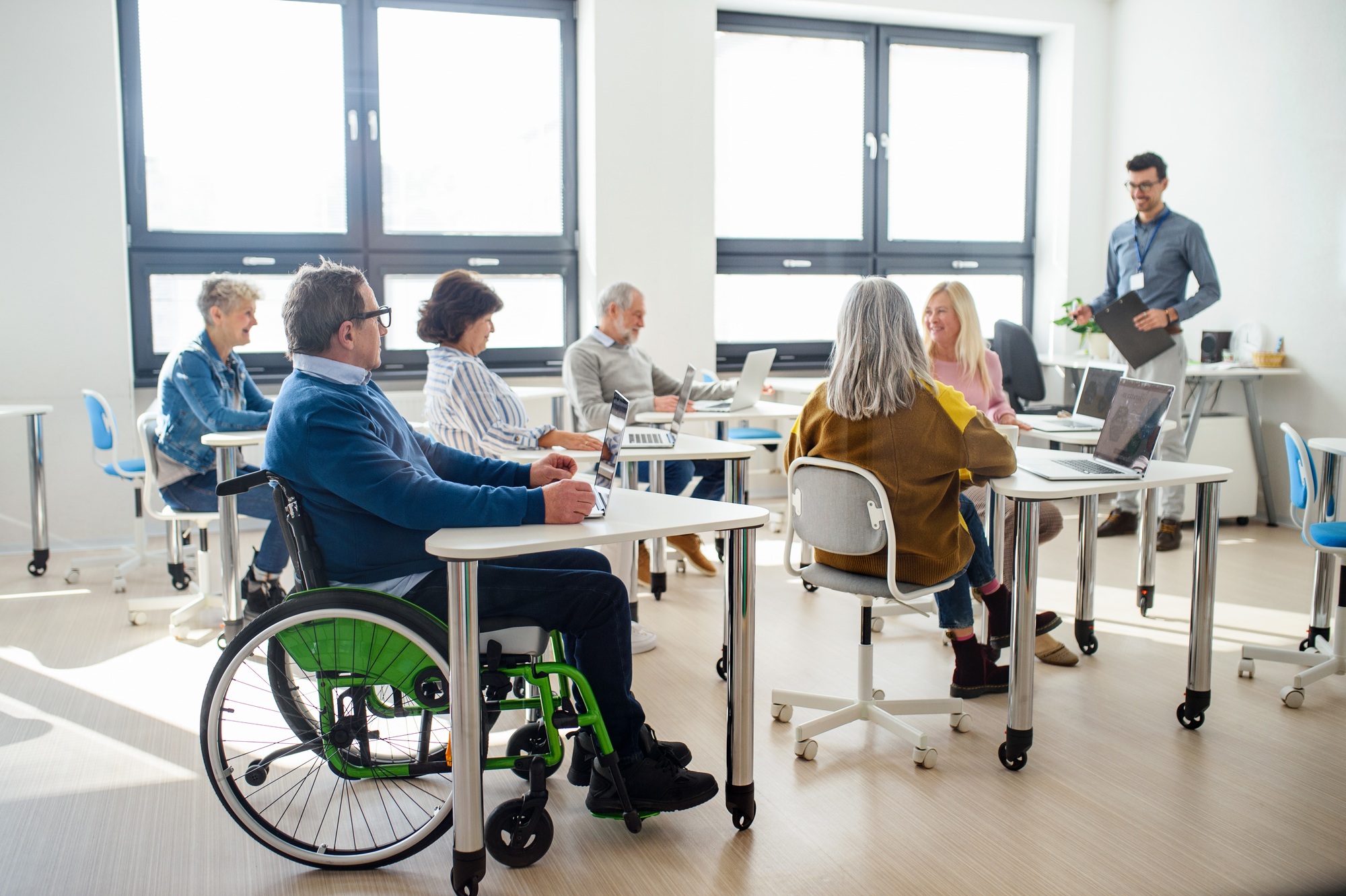 Group of senior people attending computer and technology education class