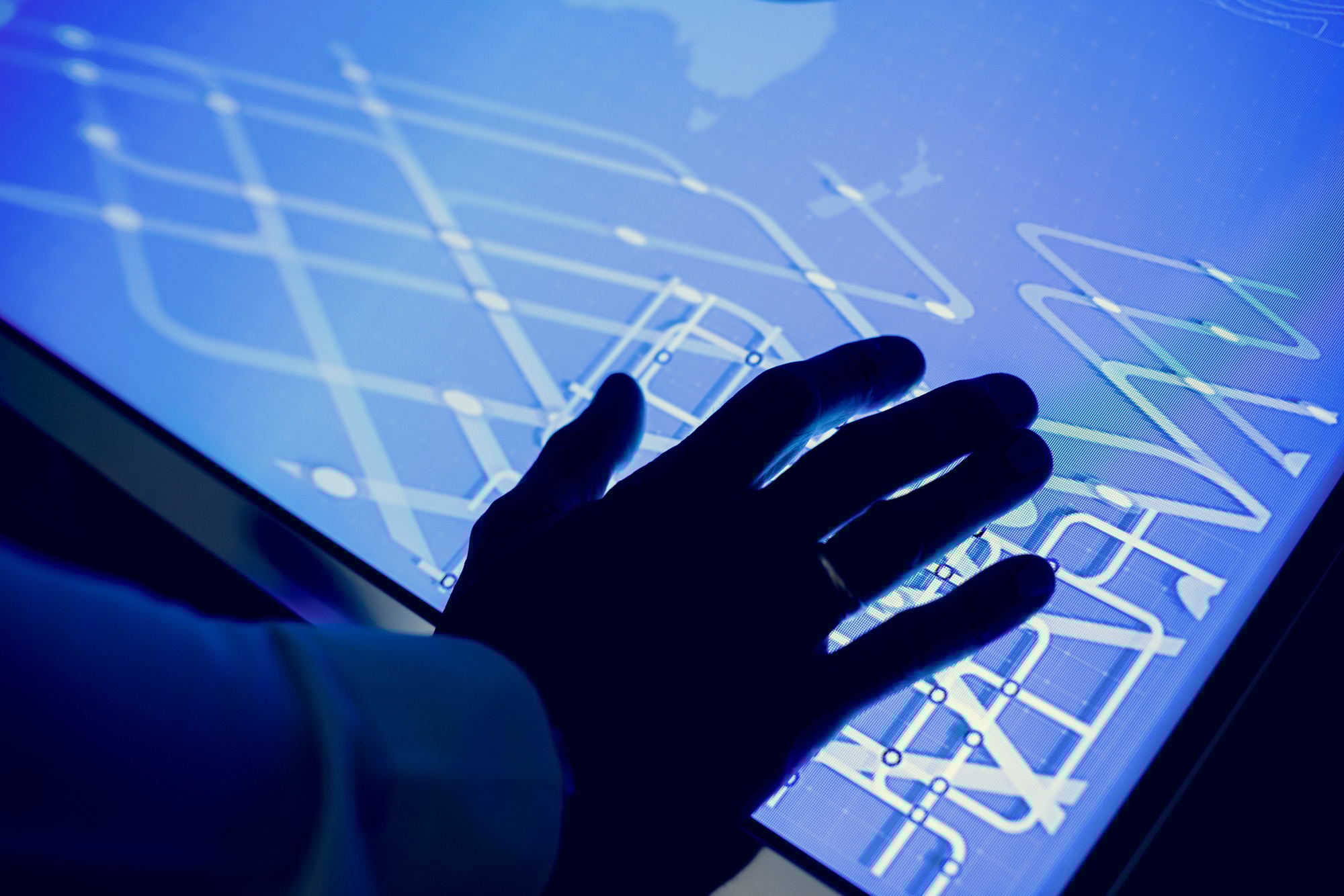 Hand on a cyber space table